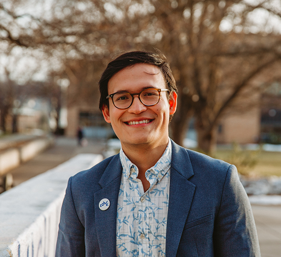 A woman leans against a railing